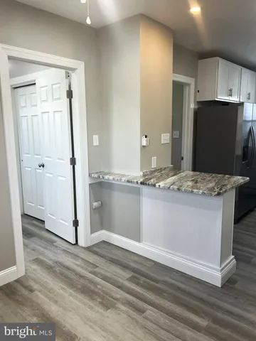 a view of kitchen island wooden floor