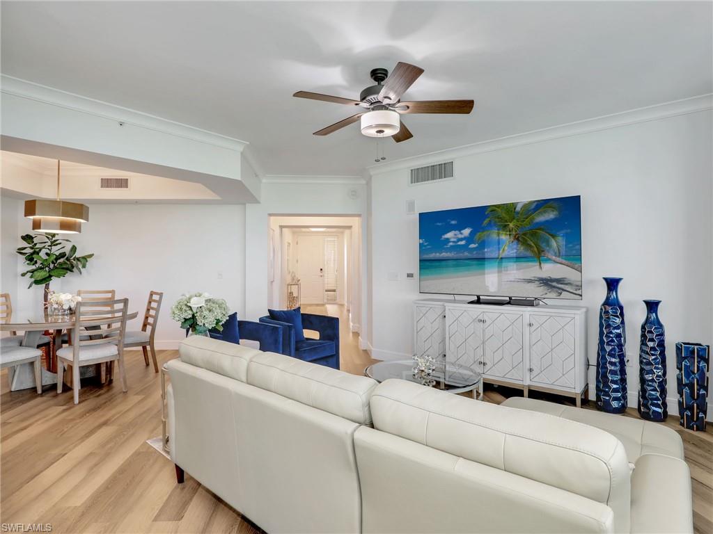325 Dunes Boulevard, Unit 403 Naples, FL 34110 - Photo 18 of 49 a living room with furniture and a flat screen tv