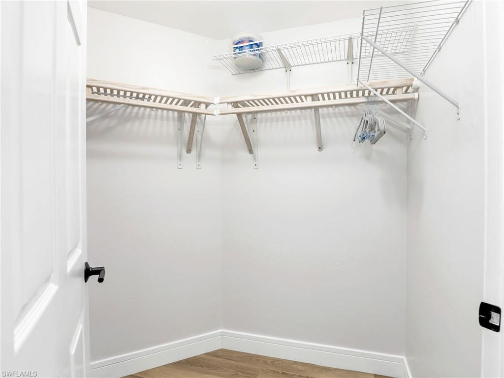 325 Dunes Boulevard, Unit 403 Naples, FL 34110 - Photo 27 of 49 a white bath tub sitting in a white bathroom