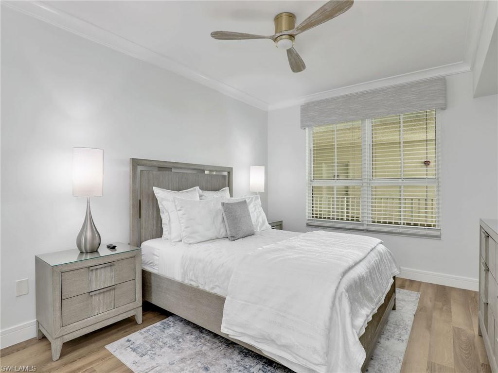 325 Dunes Boulevard, Unit 403 Naples, FL 34110 - Photo 29 of 49 a bedroom with bed and window