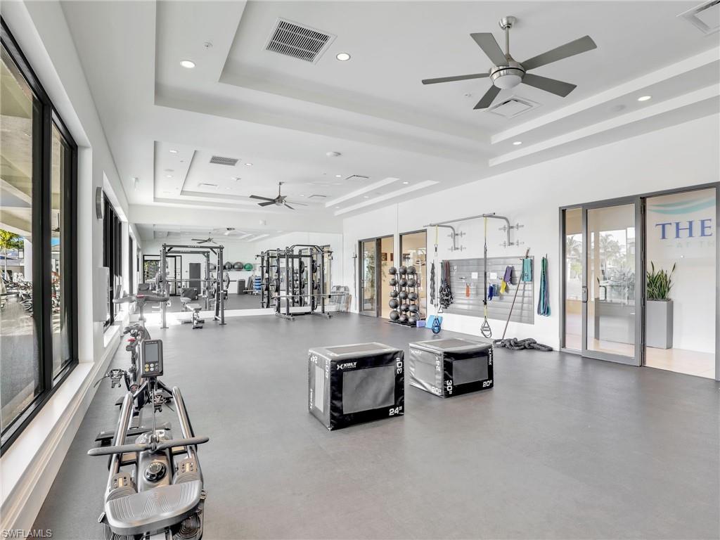 325 Dunes Boulevard, Unit 403 Naples, FL 34110 - Photo 35 of 49 a living room with furniture and a large window