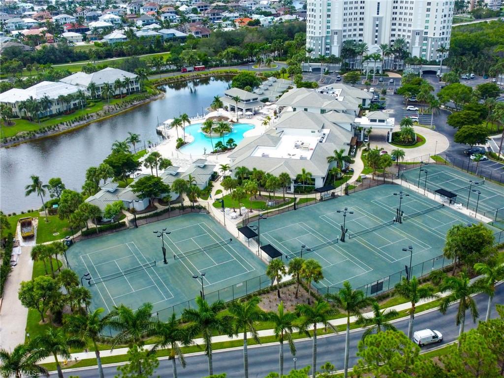 325 Dunes Boulevard, Unit 403 Naples, FL 34110 - Photo 38 of 49 an aerial view of a house with a garden and lake view