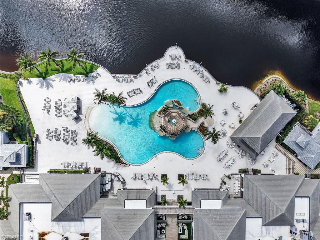 325 Dunes Boulevard, Unit 403 Naples, FL 34110 - Photo 48 of 49 an aerial view of a wooden table and chairs