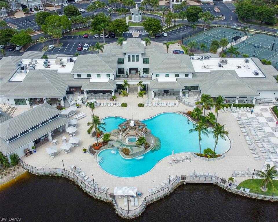 325 Dunes Boulevard, Unit 403 Naples, FL 34110 - Photo 49 of 49 an aerial view of a swimming pool with outdoor seating