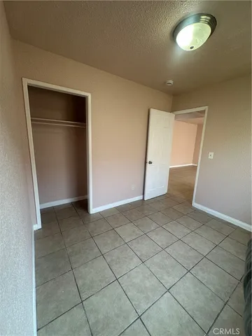 a view of an empty room with a fireplace