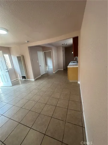 a view of a livingroom with an empty space and a sink