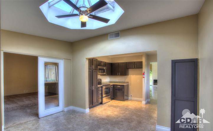 1723 Ramon Road, Unit 37 Palm Springs, CA 92264 - Photo 2 of 10 a view of an empty room with a kitchen
