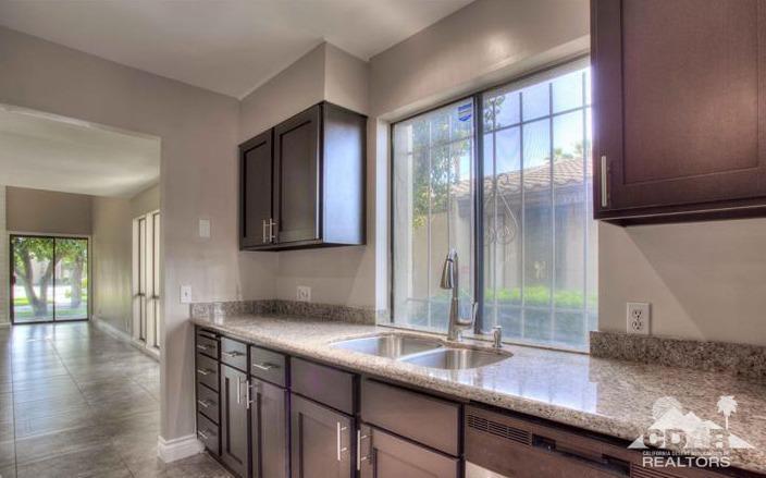 1723 Ramon Road, Unit 37 Palm Springs, CA 92264 - Photo 4 of 10 a kitchen with granite countertop a sink and a window