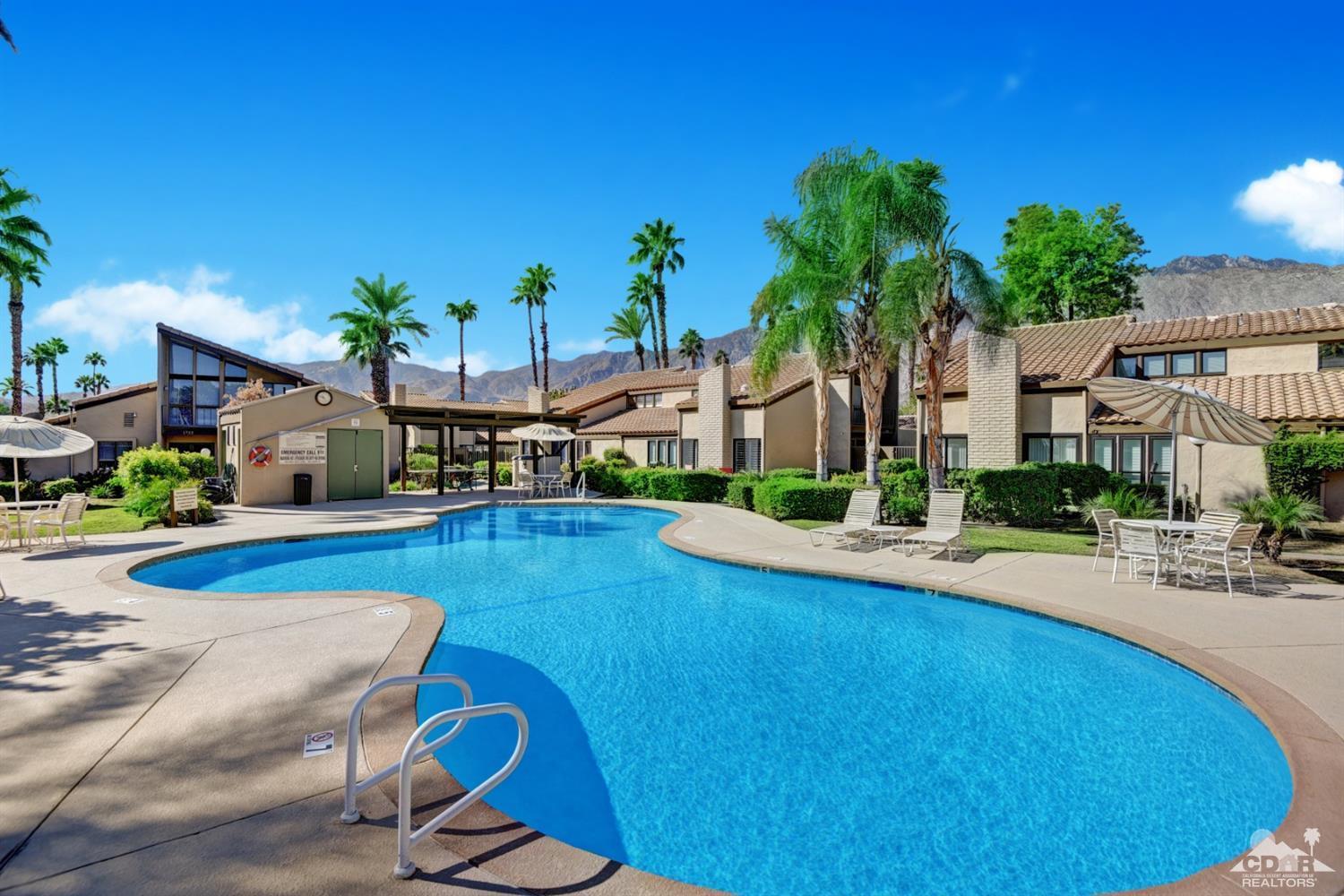 1723 Ramon Road, Unit 37 Palm Springs, CA 92264 - Photo 7 of 10 a swimming pool with outdoor seating and yard