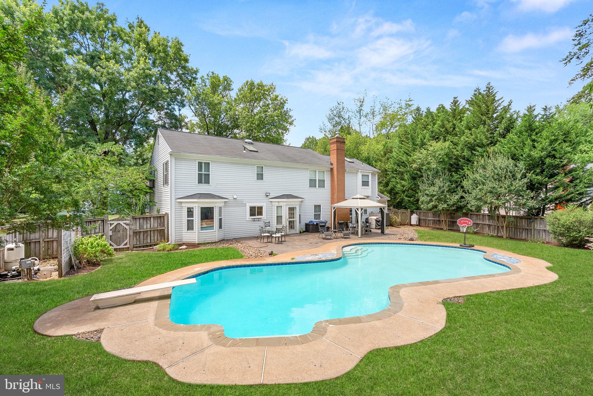 HUGE pool with extensive hardscape.