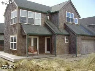 a view of brick house with large windows