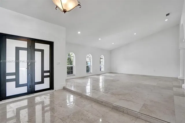 a kitchen with granite countertop a sink and a window