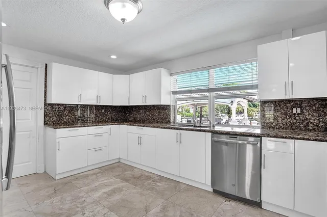 a view of room with window and a ceiling fan