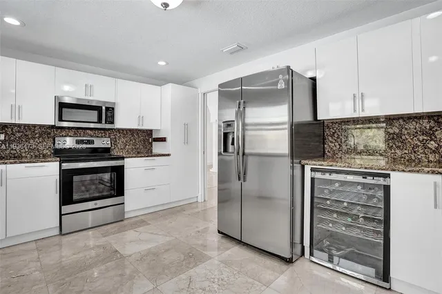 a living room with couch and wooden floor