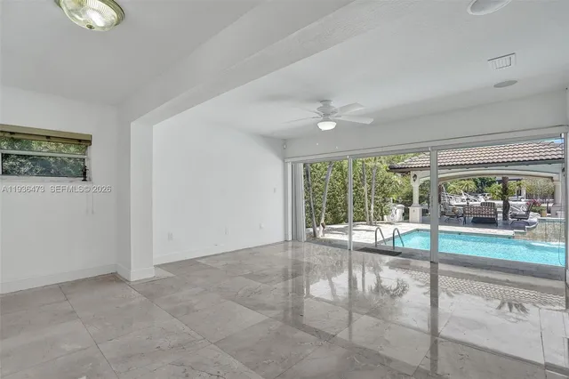 a bathroom with a granite countertop sink a mirror and a shower