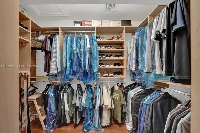 a view of a backyard with a patio and a garden