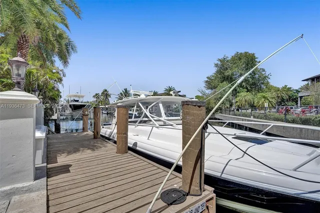 a view of a house with a yard and tree