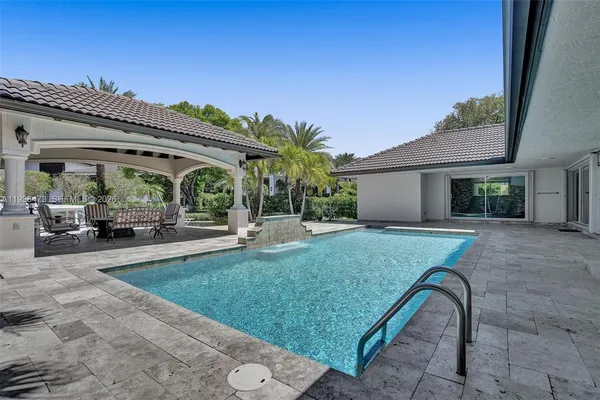 a view of house with outdoor space and sitting area