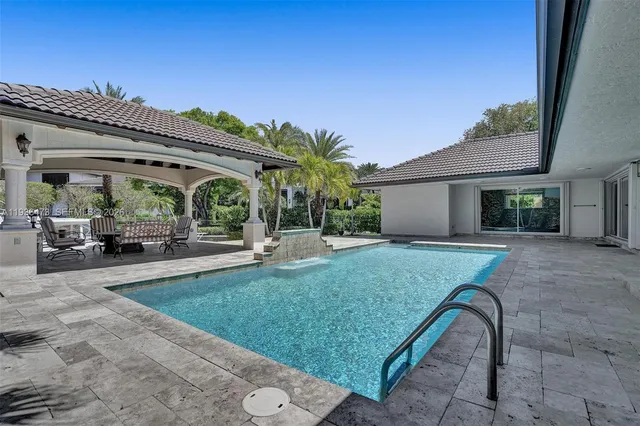 a view of house with outdoor space and sitting area