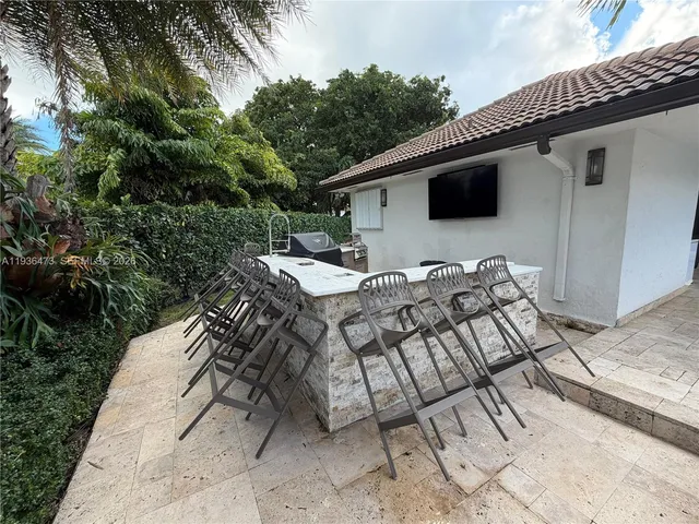a view of a hallway with wooden shelves