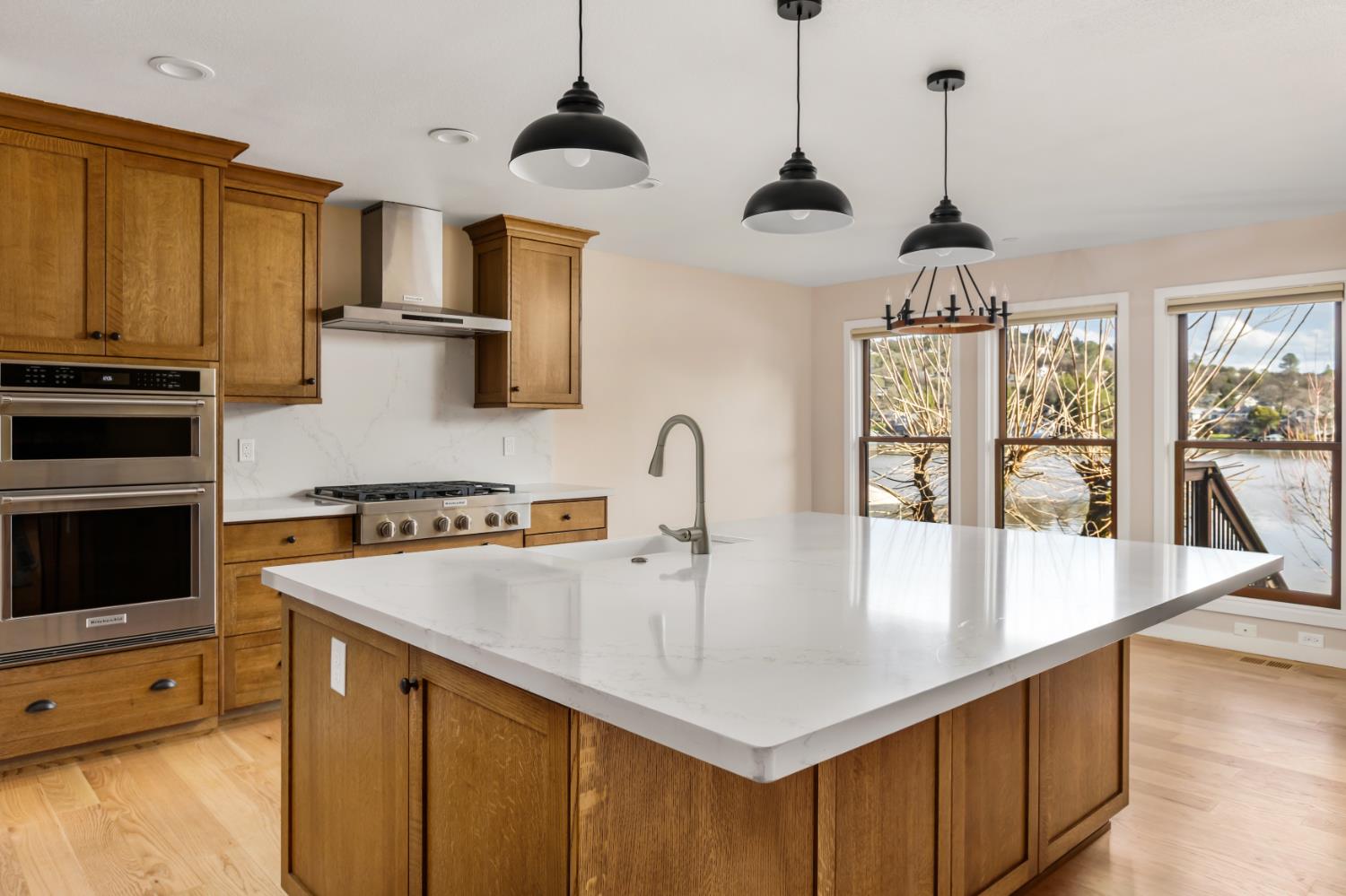 13859 Ginger Loop Penn Valley, CA 95946 - Photo 17 of 50 a kitchen with stainless steel appliances granite countertop a sink a stove and a refrigerator