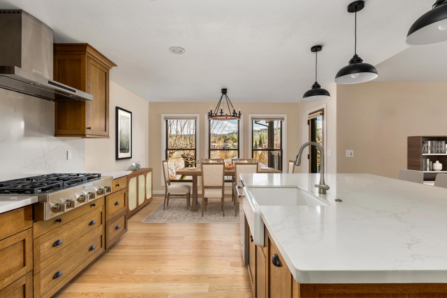13859 Ginger Loop Penn Valley, CA 95946 - Photo 18 of 50 a kitchen with stainless steel appliances dining table and chairs