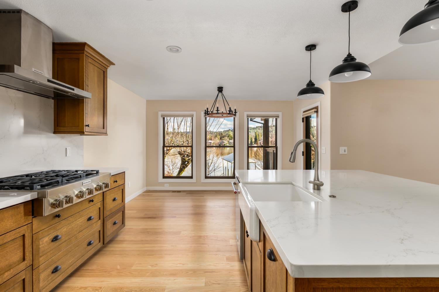 13859 Ginger Loop Penn Valley, CA 95946 - Photo 19 of 50 a spacious kitchen with stainless steel appliances granite countertop a sink stove and refrigerator