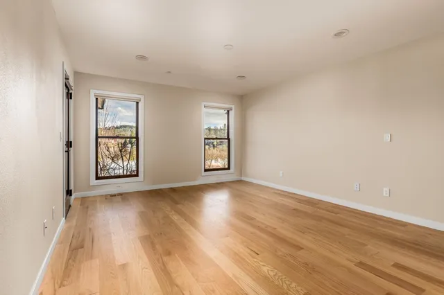 a bathroom with double vanity sinks and a mirror