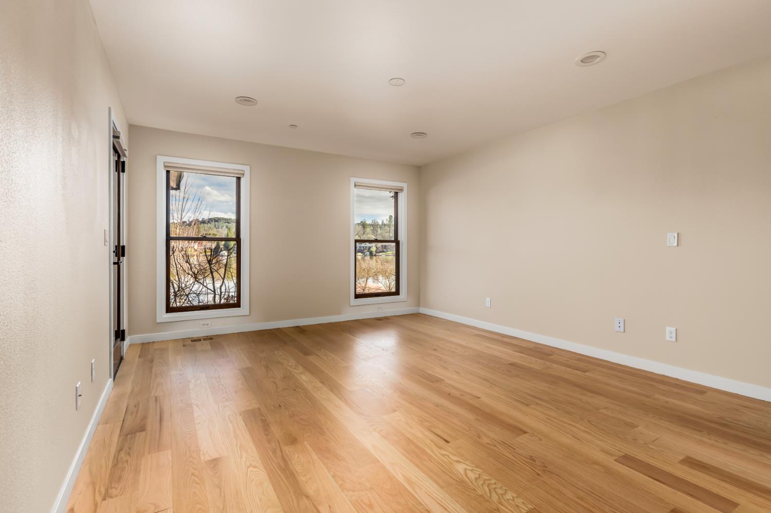 13859 Ginger Loop Penn Valley, CA 95946 - Photo 27 of 50 an empty room with wooden floor and windows