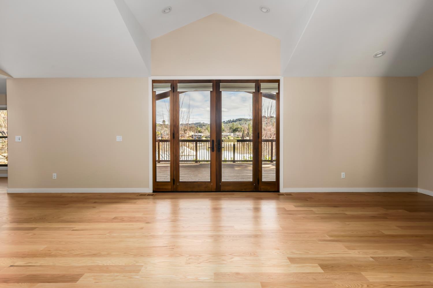 13859 Ginger Loop Penn Valley, CA 95946 - Photo 7 of 50 a view of an empty room with wooden floor and a window
