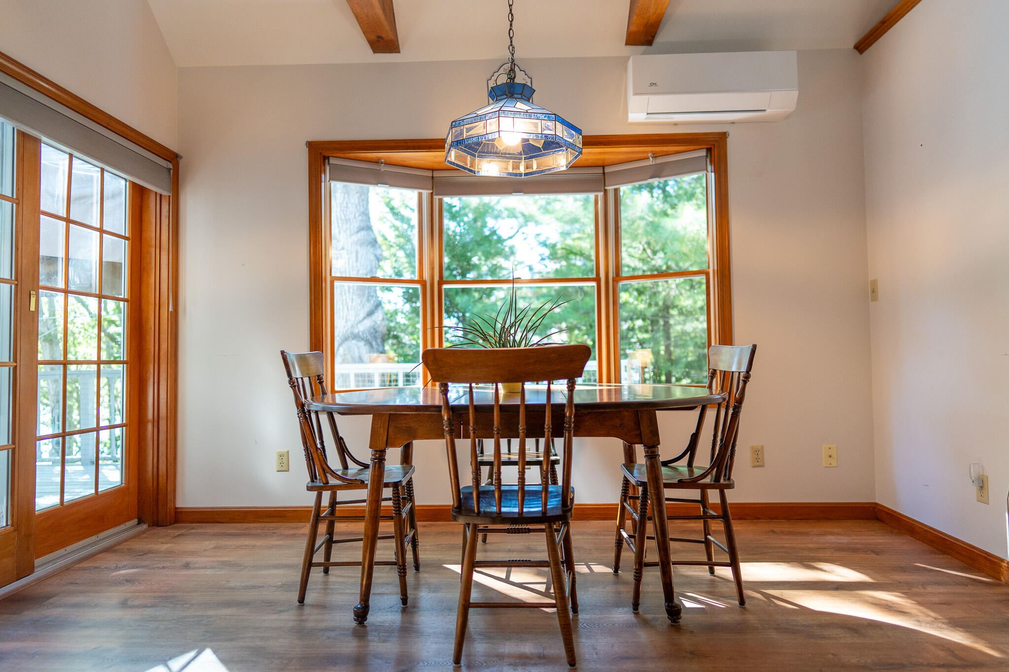 20 Kittiwake Lane Eastham, MA 02642 - Photo 21 of 75 a view of a dining room with furniture window and wooden floor