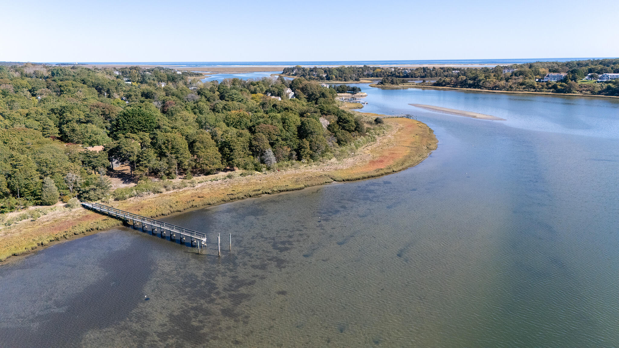 20 Kittiwake Lane Eastham, MA 02642 - Photo 3 of 75 an aerial view of a house with a yard and lake view