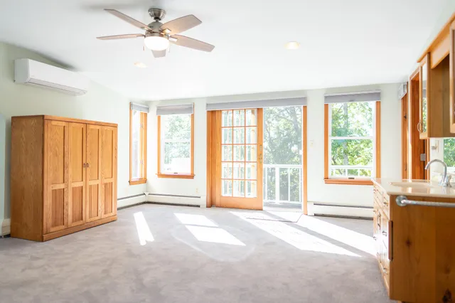 a view of a wooden deck and a backyard