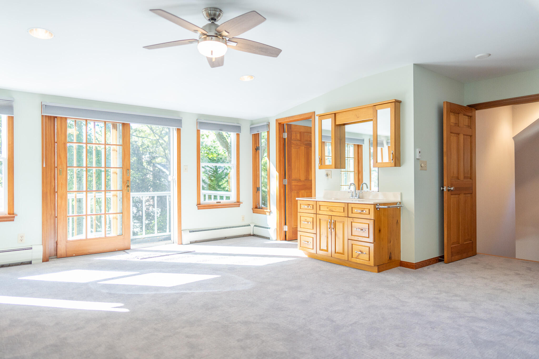 20 Kittiwake Lane Eastham, MA 02642 - Photo 44 of 75 a view of an empty room with a window and a kitchen