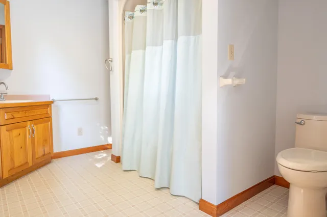 a backyard of a house with barbeque oven and outdoor seating