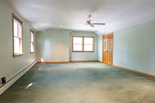 a backyard of a house with lots of green space