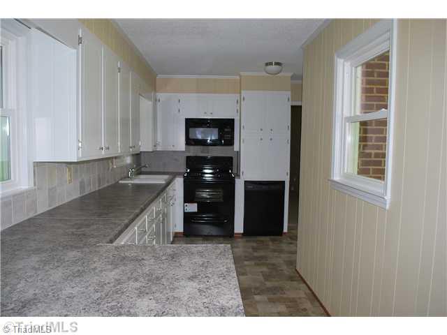 155 Madison Road Mocksville, NC 27028 - Photo 3 of 10 Kitchen. New countertops, new appliances, new sink, new windows, new flooring.