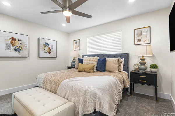 a bedroom with bed and window