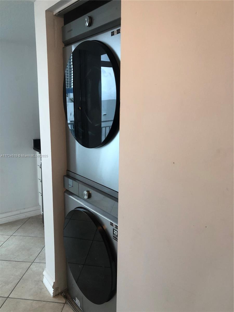 7600 Collins Avenue, Unit 1008 Miami Beach, FL 33141 - Photo 6 of 9 a close up view of a washer and dryer