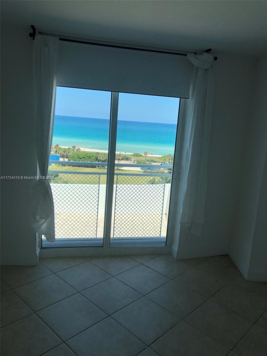 7600 Collins Avenue, Unit 1008 Miami Beach, FL 33141 - Photo 9 of 9 a view of an empty room with a window