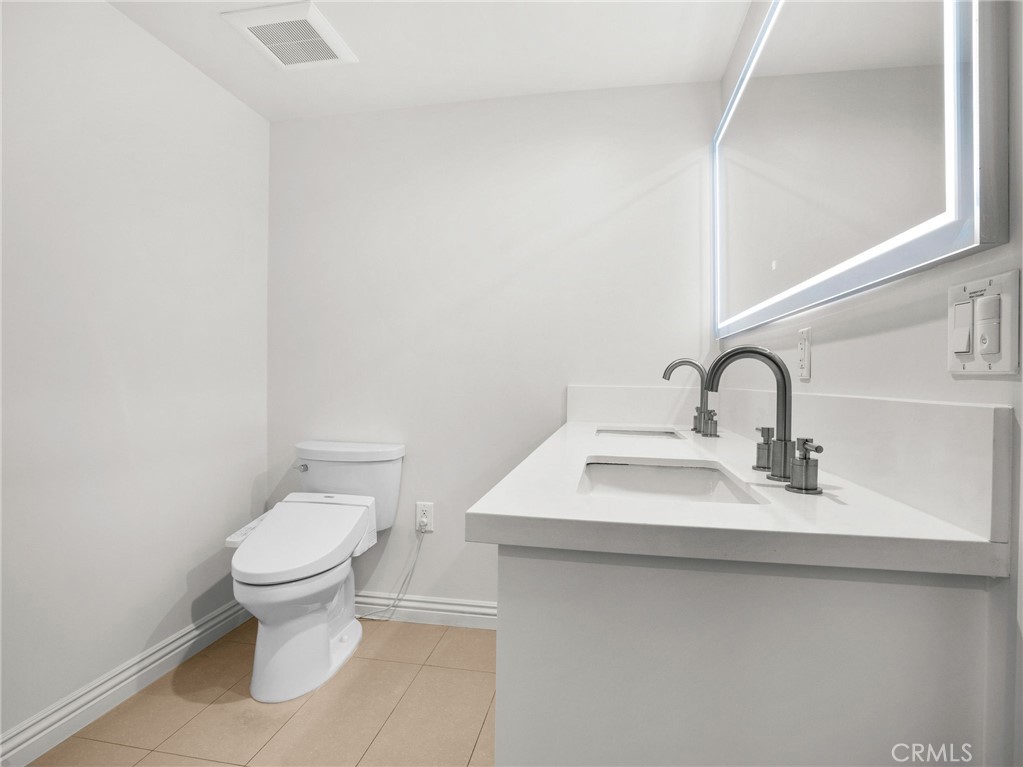 1598 Long Beach, Unit 214 Long Beach, CA 90813 - Photo 11 of 30 a bathroom with a sink and a toilet