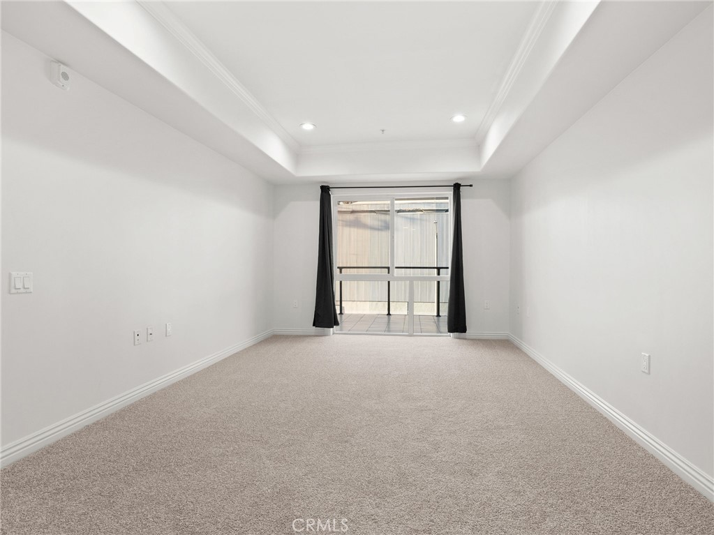1598 Long Beach, Unit 214 Long Beach, CA 90813 - Photo 15 of 30 an empty room with windows and ceiling fan
