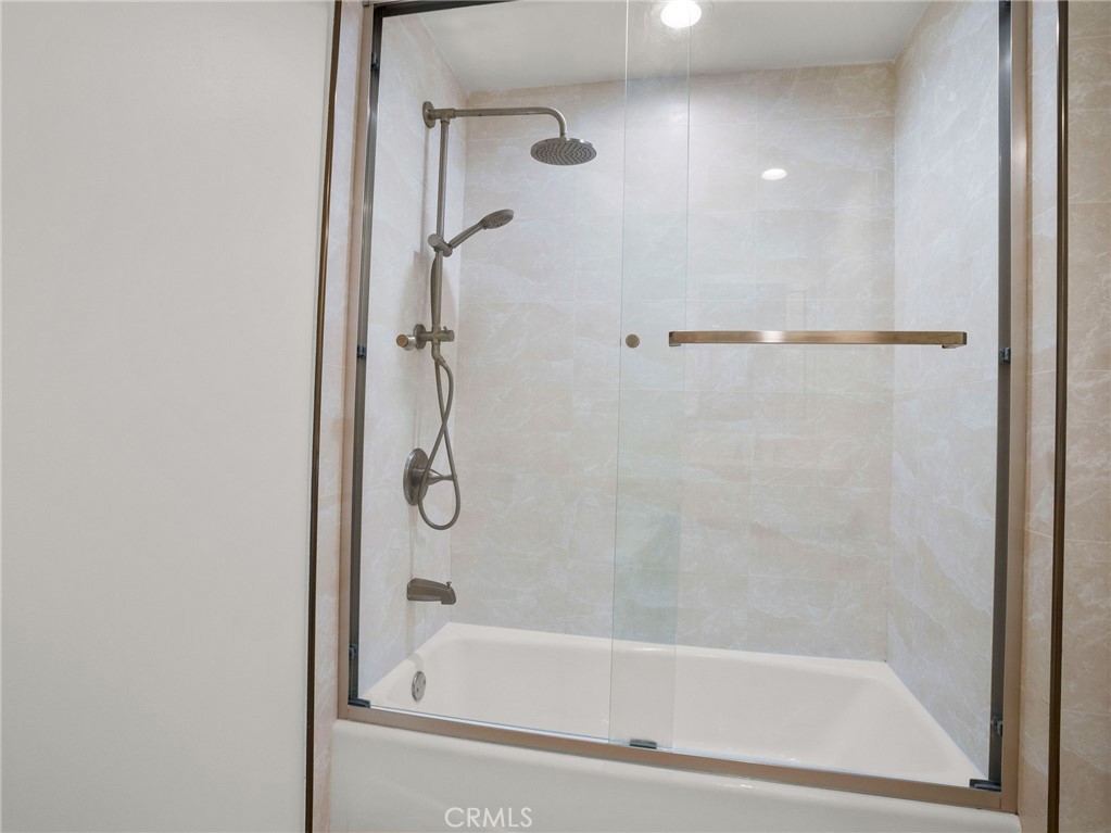 1598 Long Beach, Unit 214 Long Beach, CA 90813 - Photo 9 of 30 a bathroom with a glass shower door