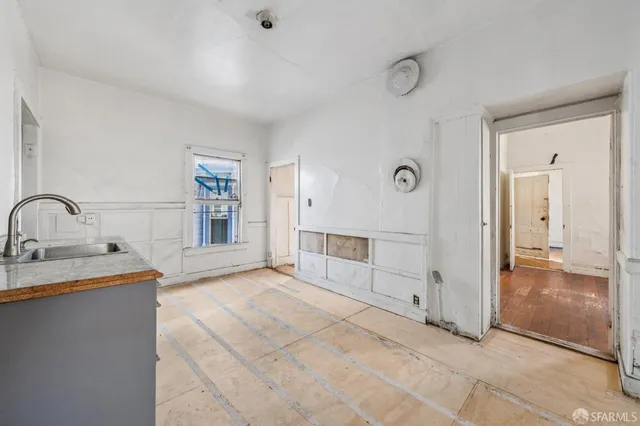 a spacious bathroom with a sink and a mirror