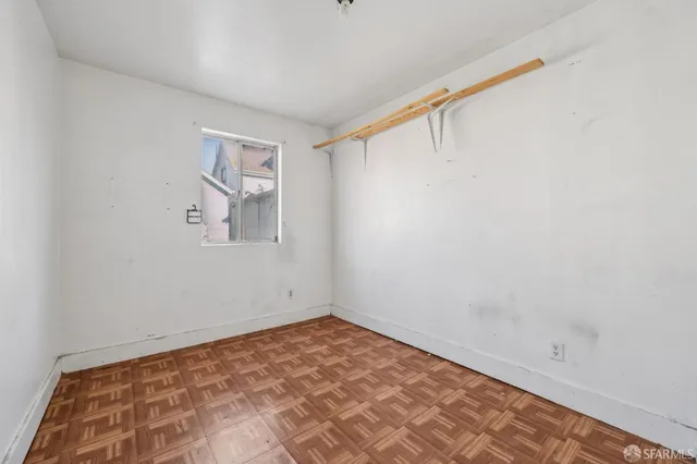 a view of a room with a empty space and a window