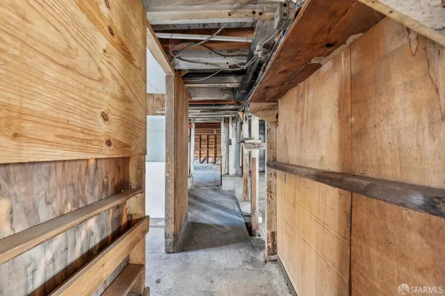 a view of an empty room with wooden walls