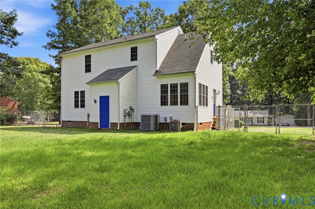 14420 Branding Iron Road Chesterfield, VA 23838 - Photo 41 of 50 Expansive grassy yard surrounding a white siding r