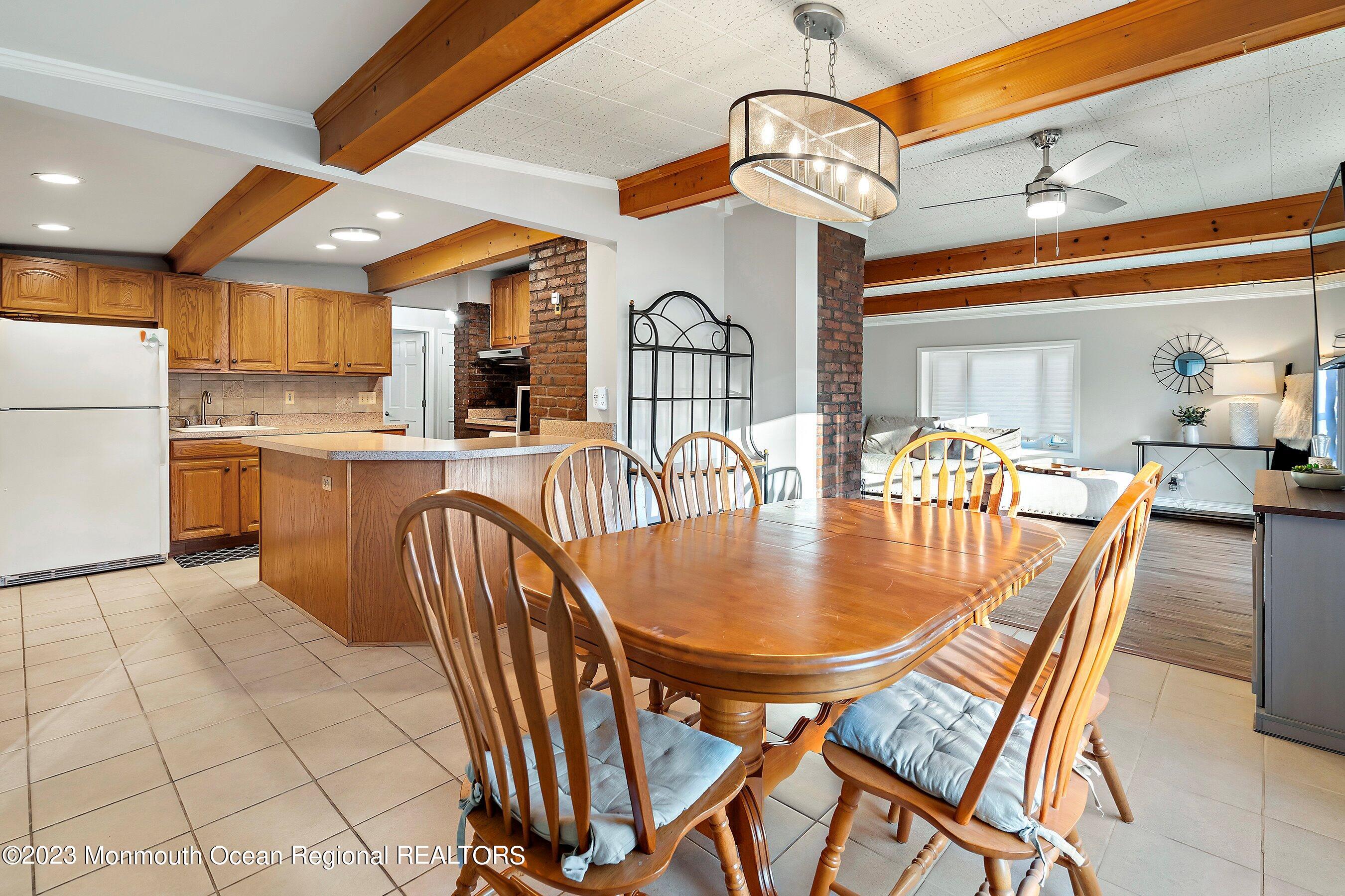 194 Sams Road Jackson, NJ 08527 - Photo 11 of 29 a dining hall with dining table and chairs