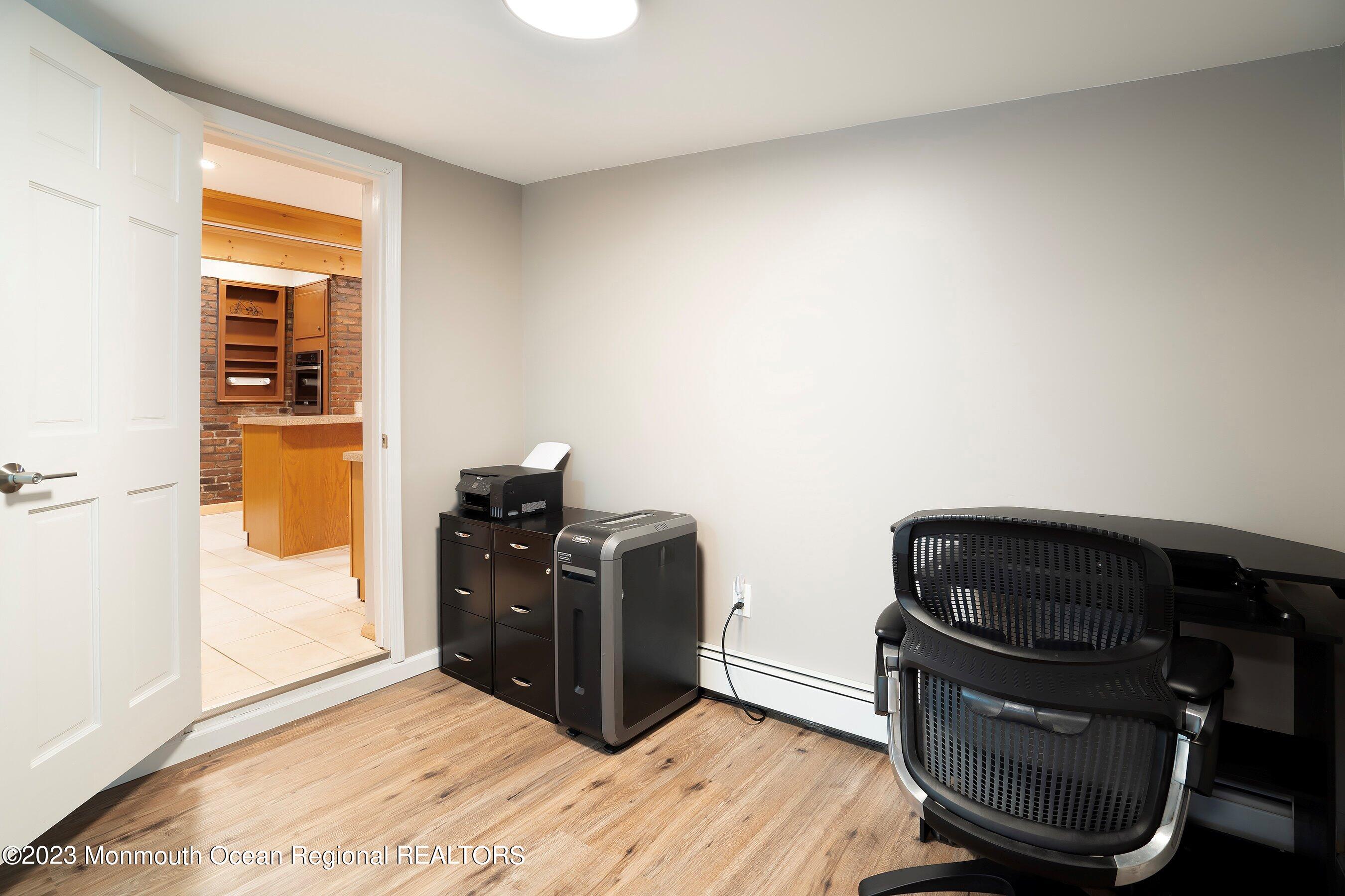 194 Sams Road Jackson, NJ 08527 - Photo 16 of 29 a view of workspace with wooden floor windows
