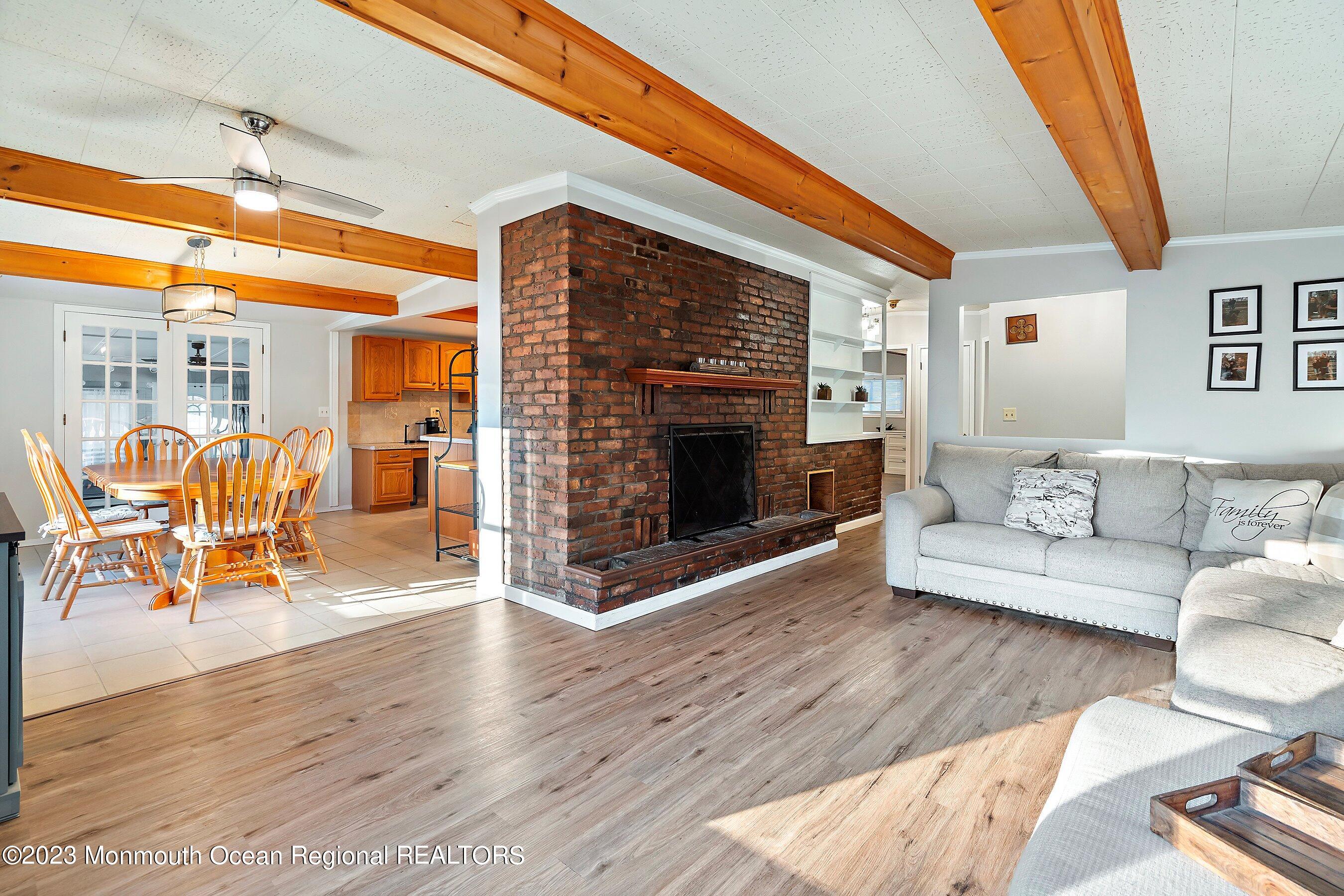 194 Sams Road Jackson, NJ 08527 - Photo 8 of 29 a living room with furniture and a fireplace